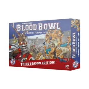 A perspective product shot of the complete Blood Bowl – Third Season Edition! (Anglais) starter set box. The large box features the metallic "WARHAMMER BLOOD BOWL" logo at the top center, and "THIRD SEASON EDITION!" in a red script at the bottom. The central artwork, based on image_14.png, is a vibrant and tense face-off between a full-plate helmet dwarf player on the left and an undead player with a skull crown on the right, both in full team regalia and looking towards each other in an open stadium. Smaller figures are depicted in action in the background, including other players and cheering spectators. The black Citadel Miniatures logo and the red, white, and blue Blood Bowl official merchandise logos are visible on the front and side panels, which also repeat the main titles. The text "THE GAME OF FANTASY FOOTBALL" is in small white text below the main logo. The box is set on a clean white surface with a few painted painted dwarf and undead miniatures around it to suggest a game in progress.