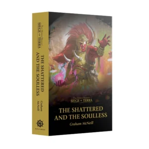 A three-quarters perspective product shot of the Warhammer sci-fi novel Siege of Terra: The Shattered and the Soulless (Paperback) (Anglais) standing upright on a solid white background, displaying both its spine and front cover. The book features a distinct bright gold spine displaying the dark text "The Horus Heresy: Siege of Terra" at the top, the main title vertically in the center, "Graham McNeill" near the bottom, and the circular Black Library logo printed in black at the base. The front cover depicts a dramatic illustration of the towering, red-skinned primarch Magnus the Red. He is shown with long crimson hair, wearing ornate golden armor with horns, his single eye glowing white as he casts a swirling pink and purple fire spell from his outstretched hand. In the hazy, warm-toned background, ruins of grand structures and warriors on floating discs are visible above a dark, silhouetted army of soldiers crowding the bottom. The title is written in large gold serif letters at the bottom-center of the cover beneath the series logo.