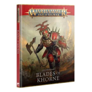 Front cover of the hardback rulebook Chaos Battletome: Blades of Khorne (Anglais) for Warhammer Age of Sigmar, shown vertically at an angle on a white background. At the top, the large gold metallic Warhammer Age of Sigmar logo rests on a dark red banner. The central illustration depicts a formidable Chaos warrior in red and gold plate armor, wearing a gridded helmet surmounted by the icon of Khorne. The champion strides forward holding a blood-stained battleaxe and a shield featuring a snarling demonic face, over a ground strewn with skulls and a charging horde beneath a burning sky. At the bottom, the text reads "CHAOS BATTLETOME" above "BLADES OF KHORNE" in large white capital letters, while the red spine on the left displays the title and logo.