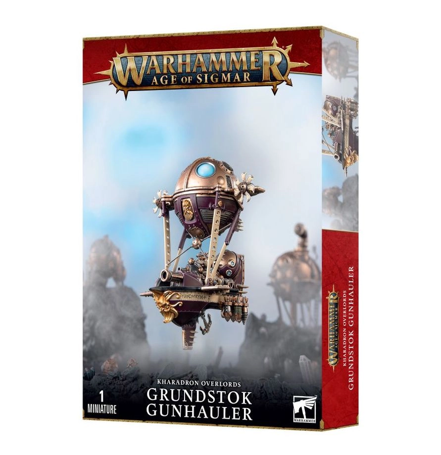 Boîte de produit officielle du kit de la Canonnière Grundstok (Grundstok Gunhauler) pour la faction Kharadron Overlords dans Warhammer Age of Sigmar. L'emballage vertical présente en haut le logo officiel Warhammer Age of Sigmar en lettres métalliques dorées sur une bannière rouge bordeaux. L'illustration centrale montre un petit navire céleste blindé aux nuances de cuivre, de bronze et de violet sombre, maintenu dans les cieux par un ballon métallique sphérique. Le vaisseau est équipé d'un imposant canon à la proue et piloté par un équipage Duardin au-dessus d'un paysage montagneux brumeux. En bas à gauche, la mention « 1 MINIATURE » surmonte les inscriptions « KHARADRON OVERLORDS GRUNDSTOK GUNHAULER » en capitales blanches, accompagnées du logo carré blanc Citadel Warhammer à droite.