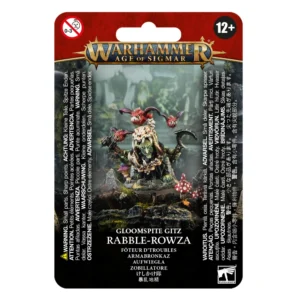 Visuel du blister de présentation Warhammer Age of Sigmar pour la figurine du Fôteur d'Troubles (Rabble-Rowza) de la faction Gloomspite Gitz. L'emballage affiche en haut le logo officiel doré "Warhammer Age of Sigmar" sur un fond rouge. L'illustration centrale met en scène un Grot à la peau verte habillé d'une robe sombre et coiffé d'un crâne osseux servant de casque. Le personnage brandit une lame recourbée et un gourdin, entouré de petits Squigs ailés rouges volant autour de sa tête, le tout posé sur un terrain rocailleux garni de champignons vénéneux. Les inscriptions "GLOOMSPITE GITZ", "RABBLE-ROWZA" et sa traduction "FÔTEUR D'TROUBLES" apparaissent clairement en bas du visuel.