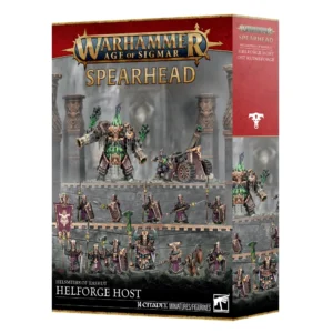 Photo de présentation sur fond blanc de la boîte de jeu Fer de Lance: Forgeruines de Hashut – Ost Ruineforgé. La boîte rectangulaire présente en haut un bandeau rouge orné de bordures dorées avec le logo "WARHAMMER AGE OF SIGMAR" au-dessus du mot "SPEARHEAD" en lettres dorées. L'illustration principale met en valeur 14 figurines de la faction Helsmiths of Hashut disposées sur les remparts d'une forteresse en pierre sombre. La partie supérieure montre une créature imposante à la lueur verte émanant de ses canons d'énergie aux côtés d'une lourde pièce d'artillerie. En dessous, deux rangées de guerriers trapus vêtus de robes violettes et d'armures sombres portent des piques, haches et boucliers. En bas de la boîte, le texte indique "HELSMITHS OF HASHUT HELFORGE HOST", accompagné du macaron "14 CITADEL MINIATURES/FIGURINES" et du logo officiel "WARHAMMER".