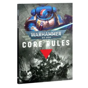 A product shot showing the front cover and thin black spine of the Warhammer 40,000 Core Rules (Anglais) book, viewed from a three-quarters angle against a white background. The upper section features a vibrant illustration of a blue-armored Ultramarines Space Marine with golden trim and a red and white striped helmet, wielding a glowing blue power sword. In the center, the iconic blue and silver Warhammer 40,000 logo is positioned above the bold white title text 'CORE RULES', which is underscored by a bright red inverted triangle. The lower half of the cover displays dramatic black and white artwork depicting grimdark soldiers engaged in fierce combat amidst ruined gothic architecture.