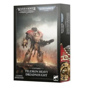 Vue en trois dimensions du packaging de la boîte de jeu du Dreadnought Lourd Telemon de l'Adeptus Custodes. La face avant arbore en haut les logos officiels « WARHAMMER THE HORUS HERESY » et « WARHAMMER 40,000 ». L'illustration centrale met en valeur un imposant marcheur de combat blindé d'or aux finitions rouges, armé d'un canon lourd et d'un puissant poing énergétique, se dressant sur un terrain de bataille enfumé et calciné. Le bas de la boîte précise la mention « CUSTODES », le titre « TELEMON HEAVY DREADNOUGHT » ainsi que l'indication « 1 CITADEL MINIATURE/FIGURINE », tandis que le bord latéral rappelle la traduction française « DREADNOUGHT LOURD TELEMON ».