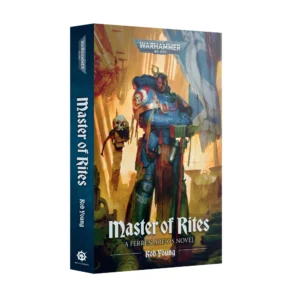 A 3D product view showing the front cover and spine of Master of Rites (Paperback) (Anglais). The cover artwork features the "WARHAMMER 40,000" logo at the top above an illustration of a Space Marine in blue power armor holding a massive hammer alongside a floating servo-skull. The title "Master of Rites" is printed near the bottom in stylized white lettering above the line "A FERREN AREIOS NOVEL" and author "Rob Young". The dark blue spine repeats the title, author's name, and the Black Library symbol at the base.